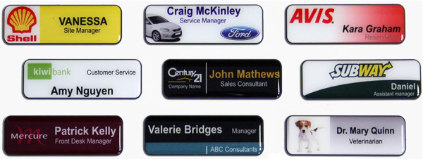 large selection of resined name badges